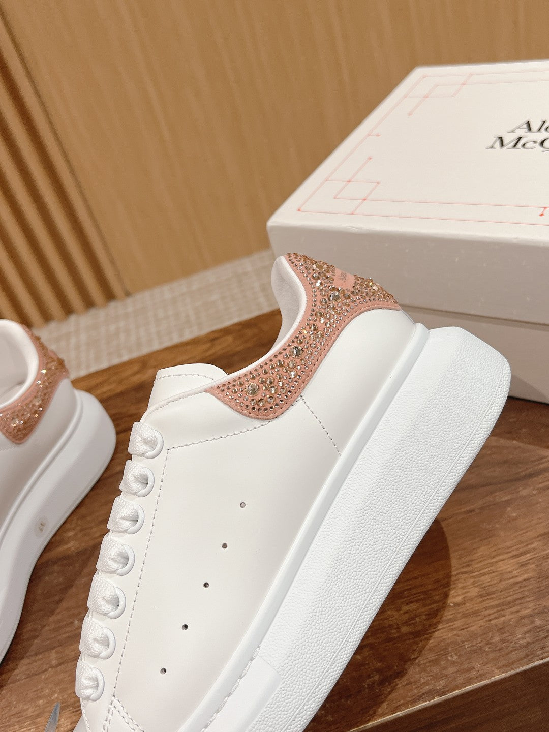 White sneaker with rose-gold glitter side panel and white lace-up upper