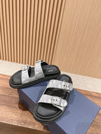 Dior slide sandals, black footbed with white monogram strap and silver buckle