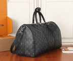 Men's Louis Vuitton monogram duffel bag with side zipper and adjustable shoulder strap