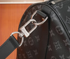 Men's Louis Vuitton monogram duffel bag close-up of D-ring hardware and zipper pull