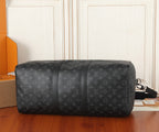 Men's Louis Vuitton monogram duffel bag side view with top handle and crossbody strap