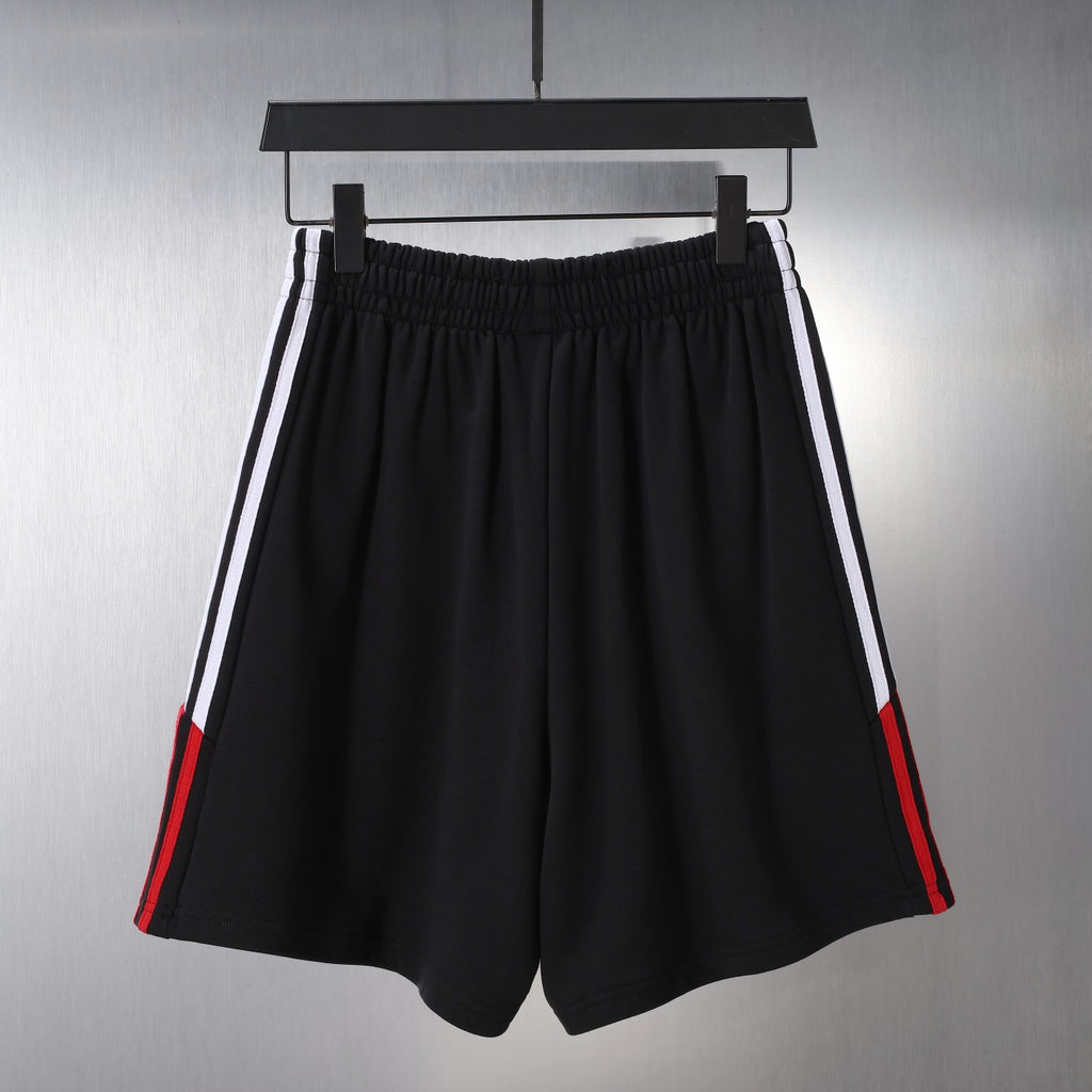 Black Balenciaga shorts with double side stripes and red trims