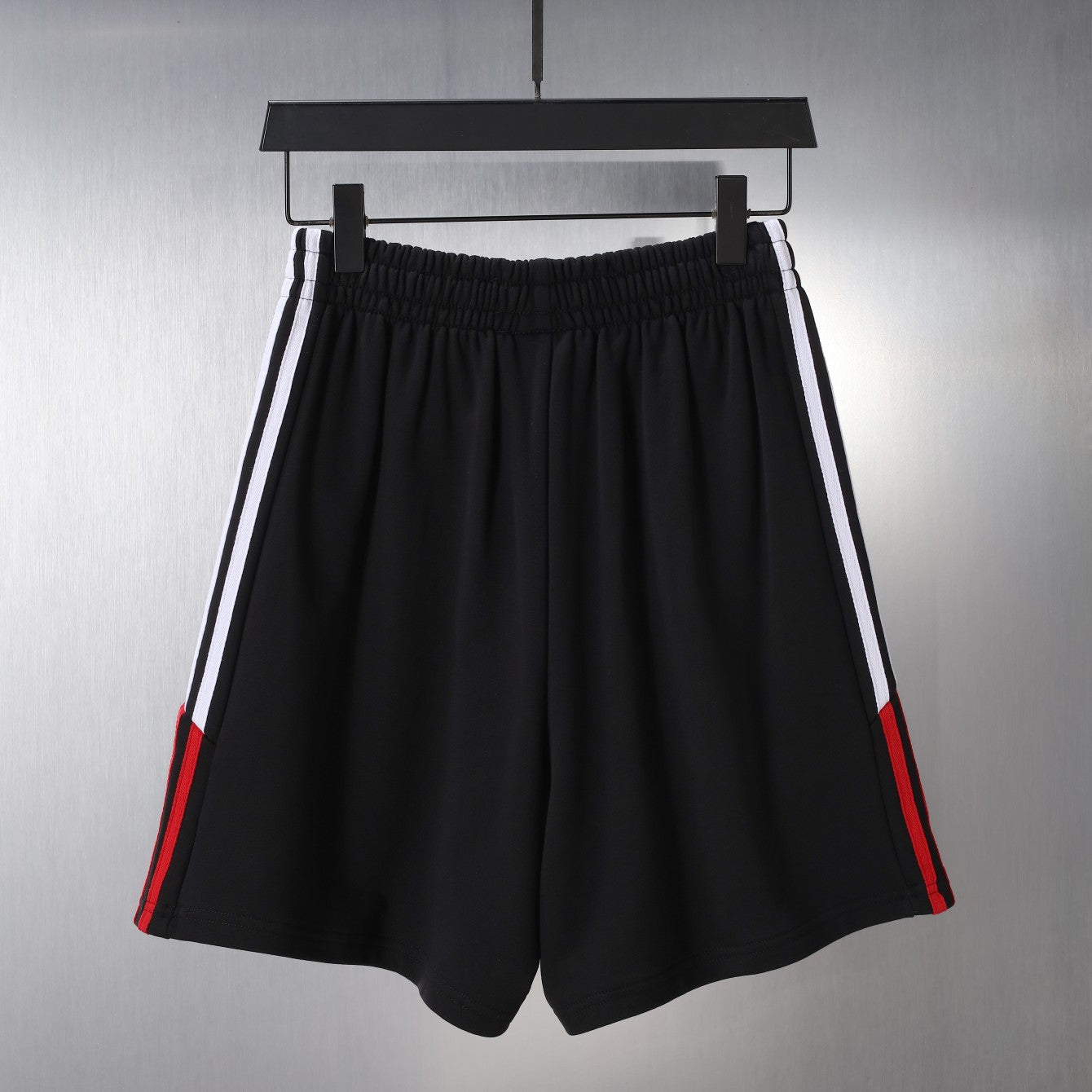 Black Balenciaga shorts with double side stripes and red trims