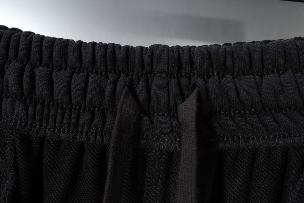 Black elastic waistband on Balenciaga shorts with stitched drawstring channel