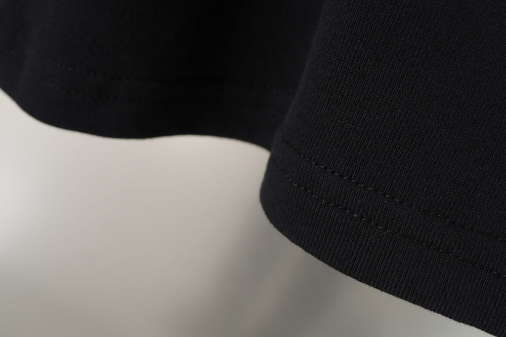 Black Balenciaga shorts hem with visible stitching and smooth cuff edge