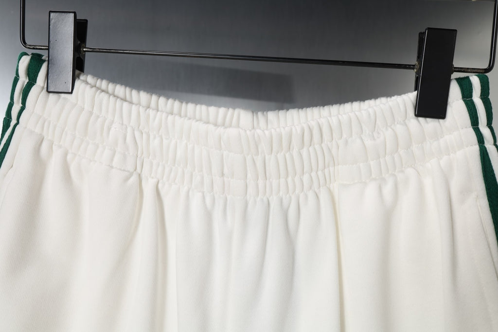 White shorts with elastic waistband and side stripe detailing