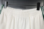 White shorts with elastic waistband and side stripe detailing