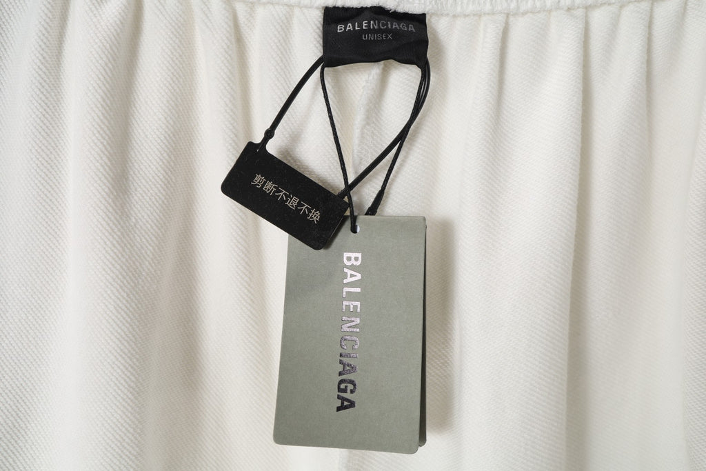 White shorts with attached Balenciaga and size tags