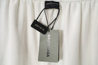 White shorts with attached Balenciaga and size tags