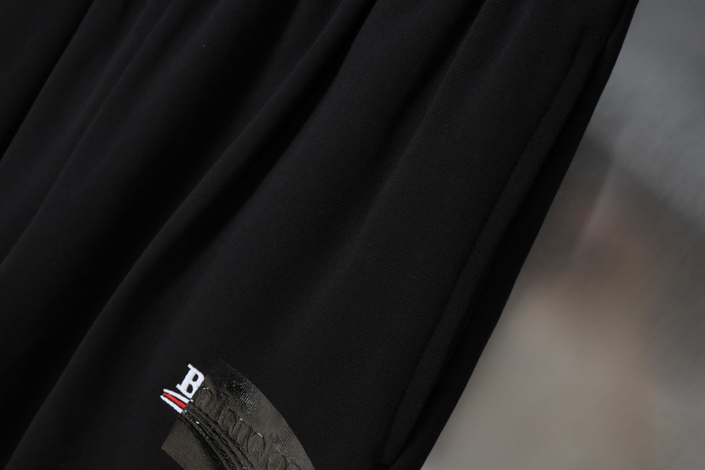 Balenciaga black shorts with embroidered logo detail on fabric