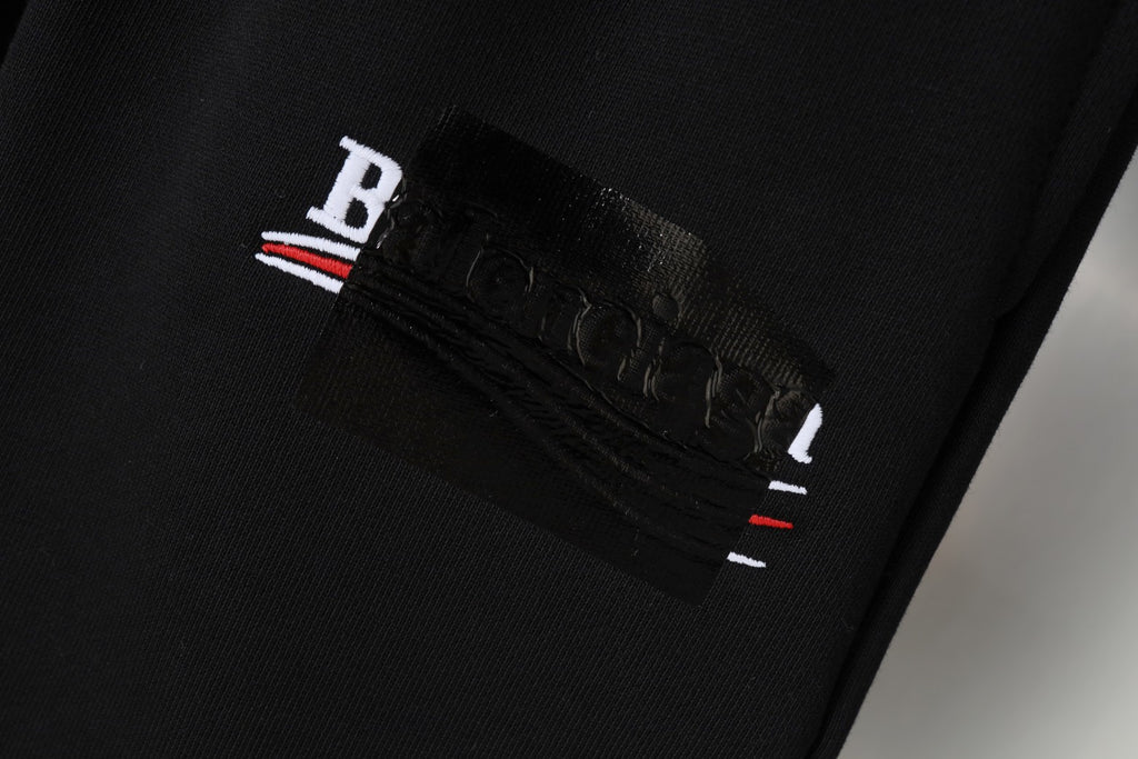 Balenciaga black shorts with embroidered logo patch on waistband