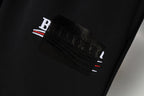 Balenciaga black shorts with embroidered logo patch on waistband