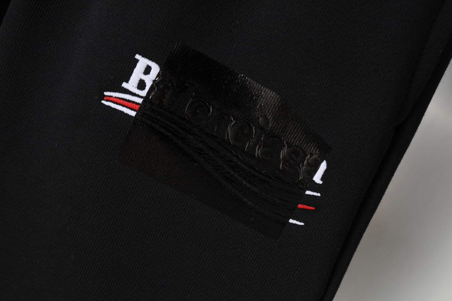 Balenciaga black shorts with embroidered logo patch on waistband