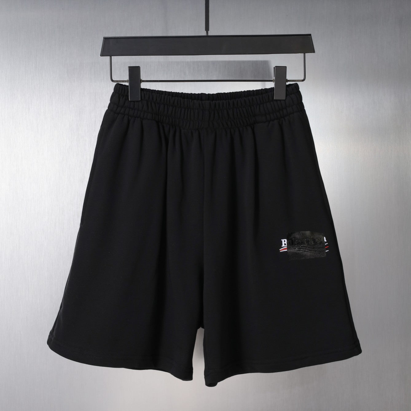 Balenciaga black shorts with elastic waistband and small logo patch