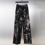 Black wide-leg pants with graphic allover print and elastic waistband