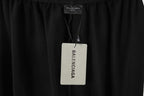 Black pants with Balenciaga label at interior waistband