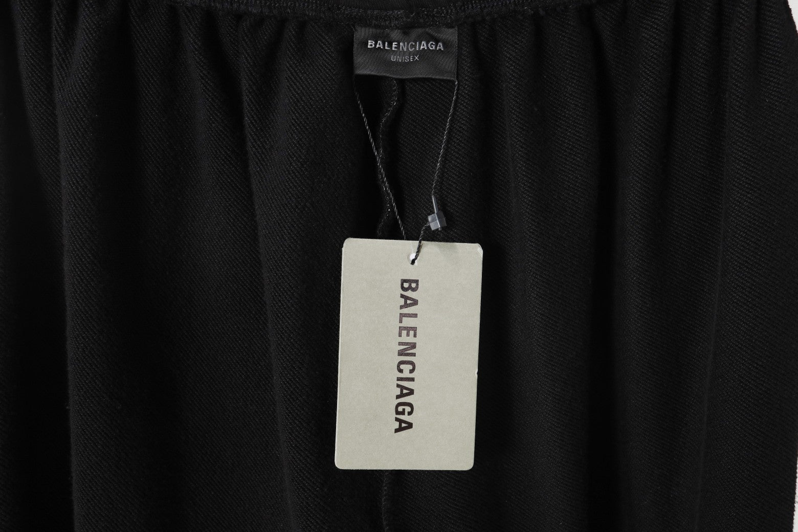 Black pants with Balenciaga label at interior waistband