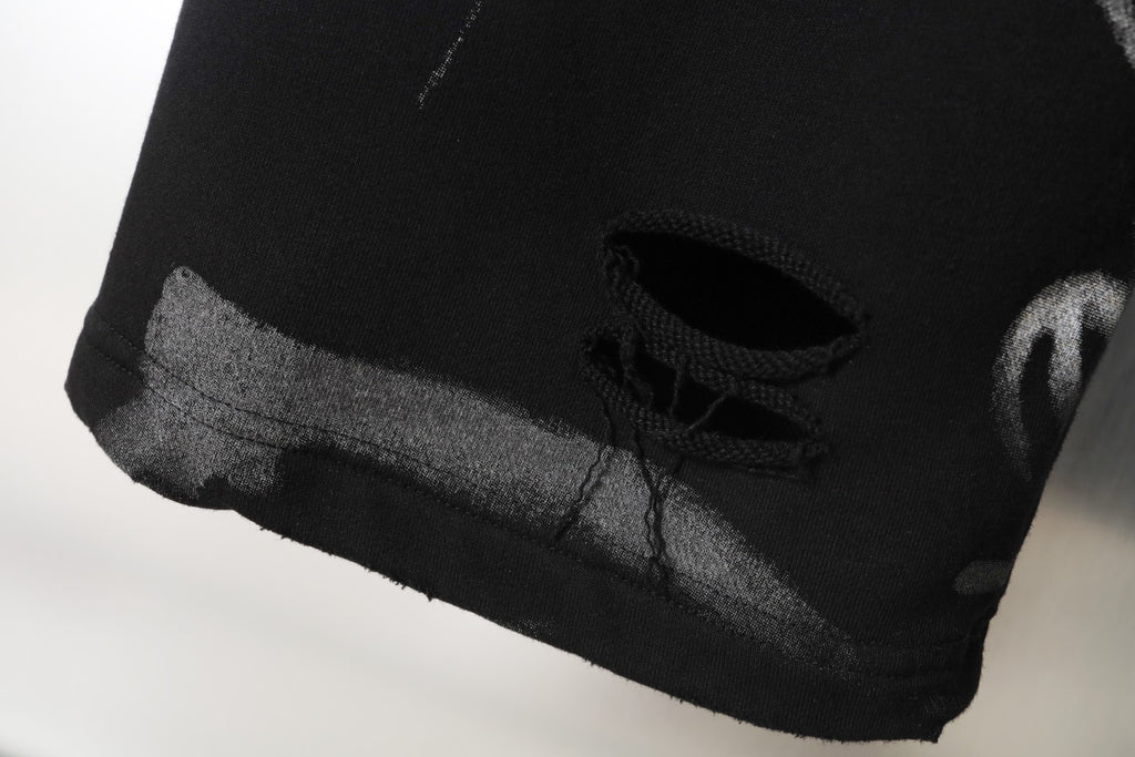 Black pants hem with hidden drawstring and textured cuff edge