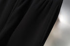 Black shorts fabric with gathered seam detail