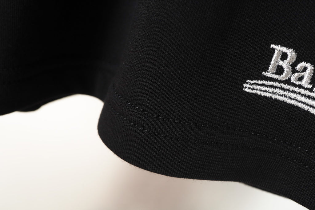 Balenciaga logo and stitched hem on black shorts