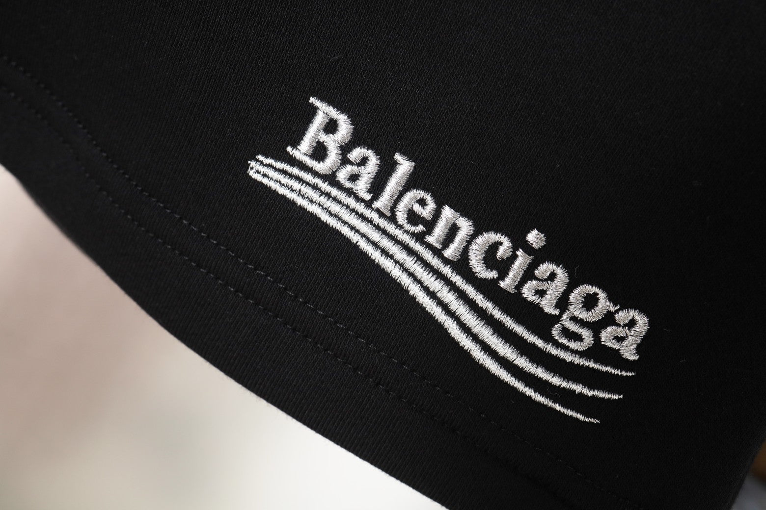 Balenciaga logo embroidery on black fabric
