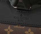 Monogram backpack close-up of embossed “LOUIS VUITTON PARIS” on leather