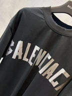Black short-sleeve T-shirt with white BALENCIAGA logo print at chest