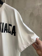 White Balenciaga T-shirt sleeve with partial logo graphic