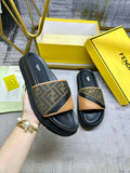 Black Fendi slide sandals with FF monogram straps and tan trim, open-toe slip-on