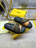 Black Fendi slides with FF monogram straps and tan leather across the top