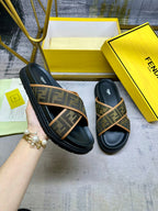 Fendi slide sandals with dark leather uppers and tan FF-pattern crossover straps