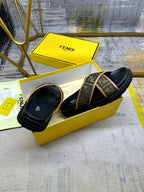 Fendi slide sandal with tan FF-pattern strap and dark rubber sole