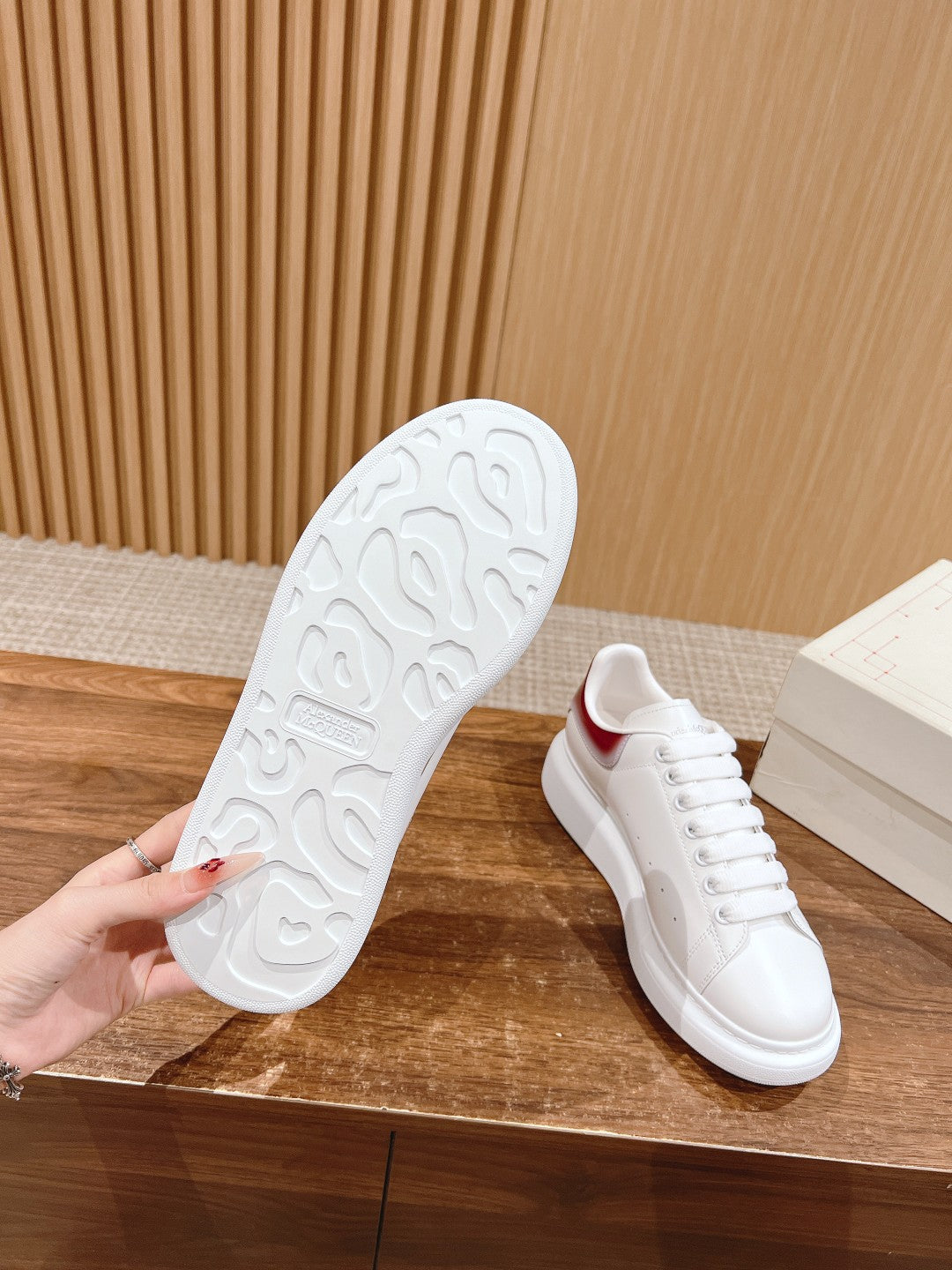 White sneaker outsole with textured tread and matching sidewall detail.