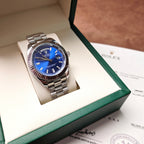 Stainless steel Rolex wristwatch with blue dial in open gift box