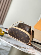 Louis Vuitton monogram oval crossbody bag with tan top handle and contrast trim