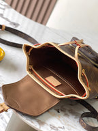Louis Vuitton monogram bag open view showing tan interior pocket and zip opening
