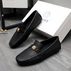 Versace luxury loafers, black embossed leather with square gold clasp