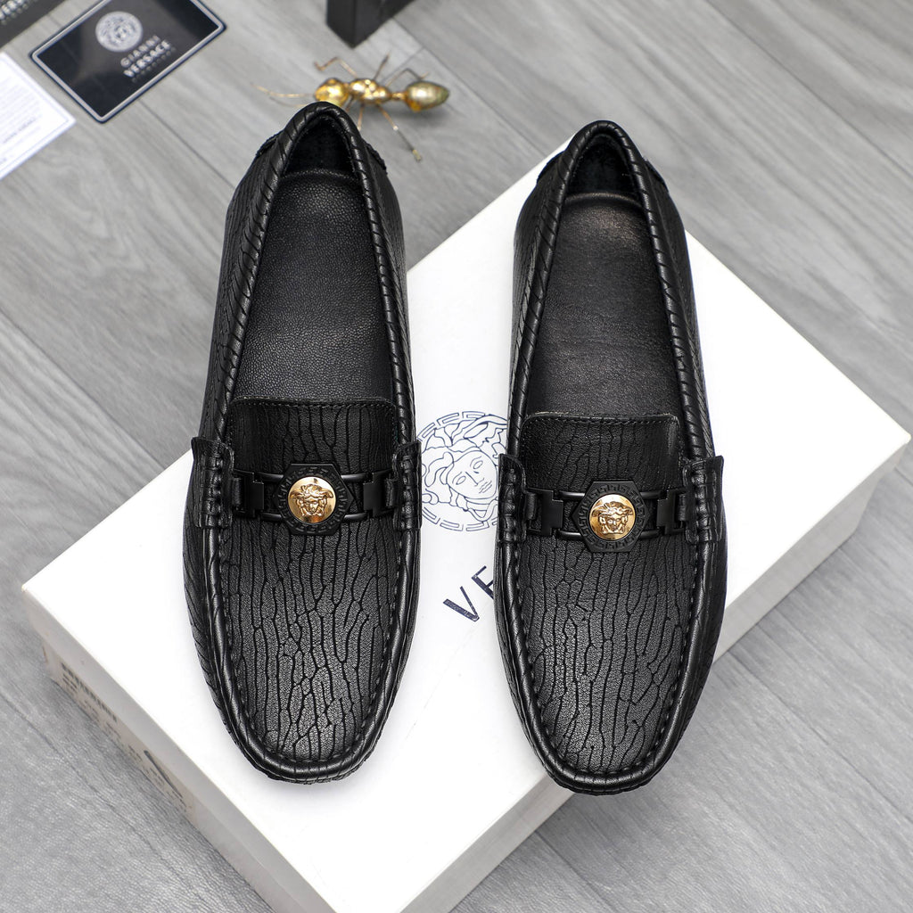 Versace luxury loafers, black embossed leather with gold buckle detail
