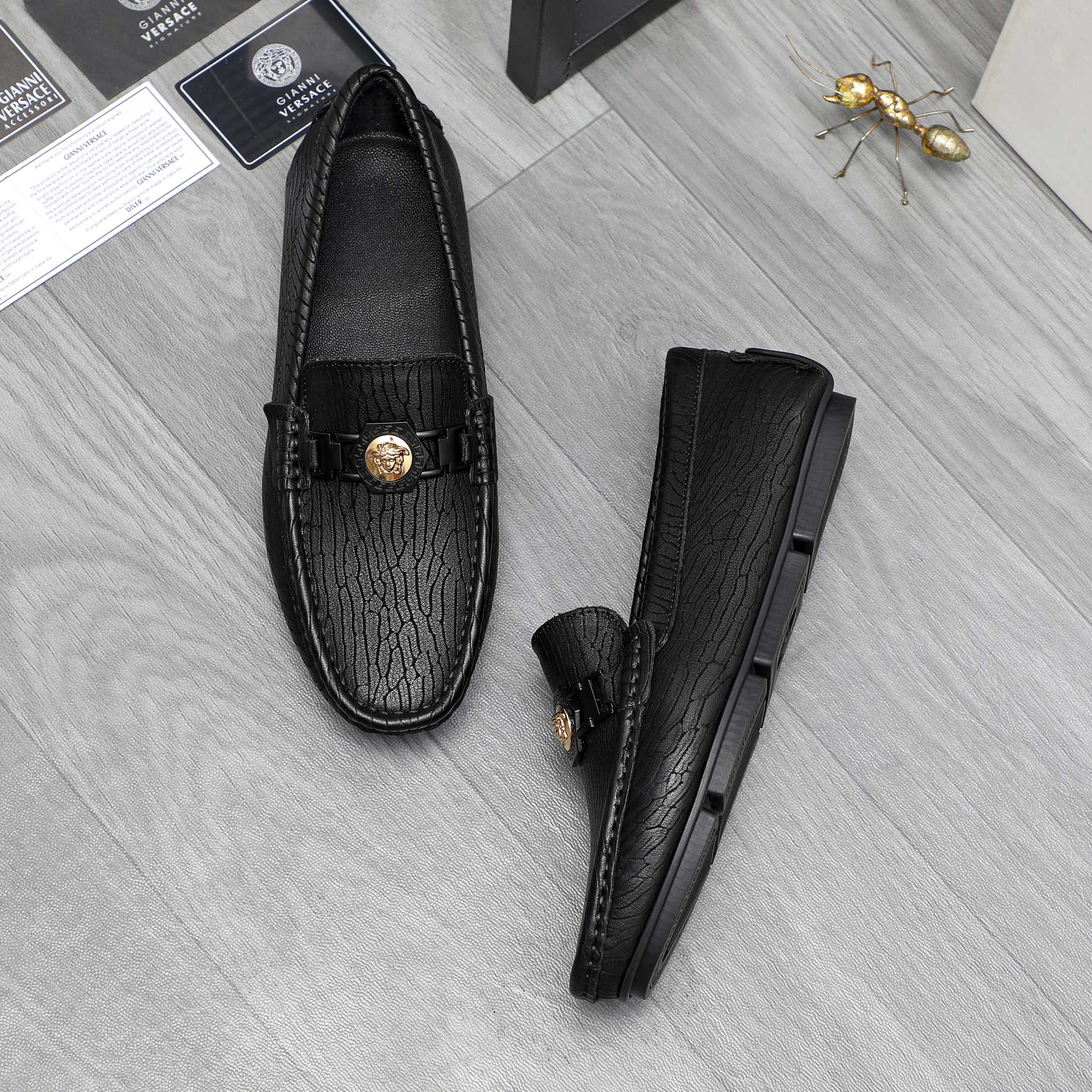 Versace luxury loafers, black embossed leather with gold buckle and strap