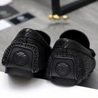 Versace luxury loafer, black outsole with logo emblem and textured grip
