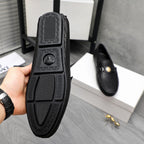 Versace luxury loafer outsole, black textured tread with logo pattern