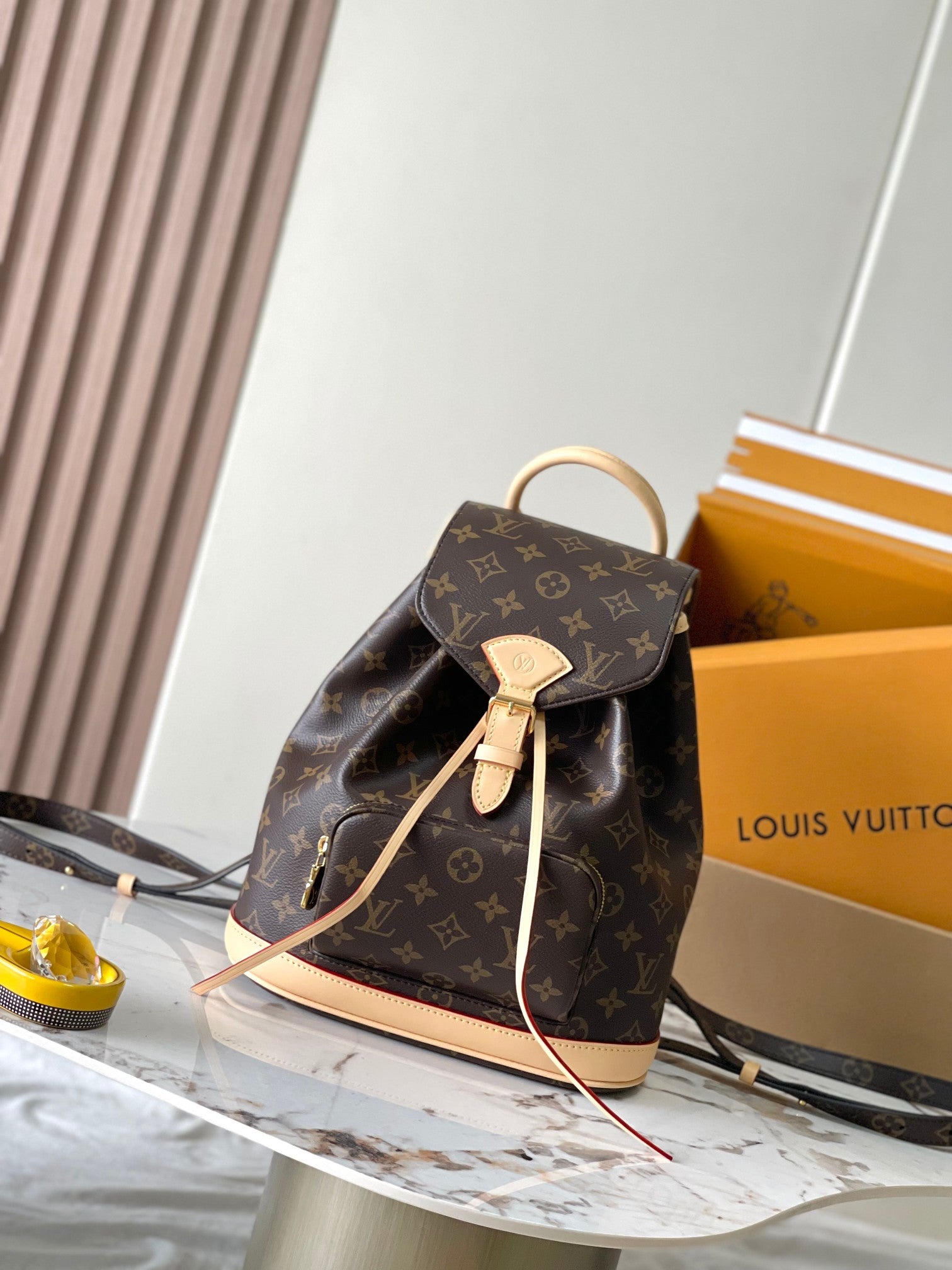 Louis Vuitton monogram mini backpack with top handle and adjustable shoulder strap