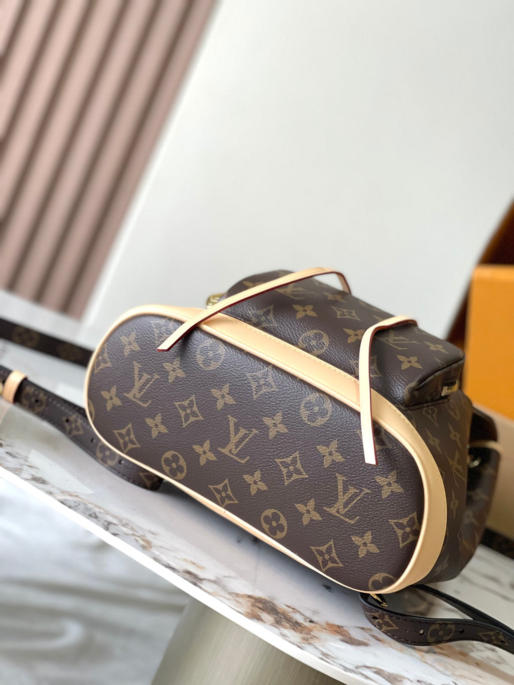 Monogram canvas bag with wide opening, curved top handle, beige edge trim