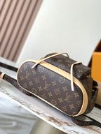 Monogram canvas bag with wide opening, curved top handle, beige edge trim