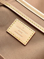Beige interior label reading Louis Vuitton Paris and made in