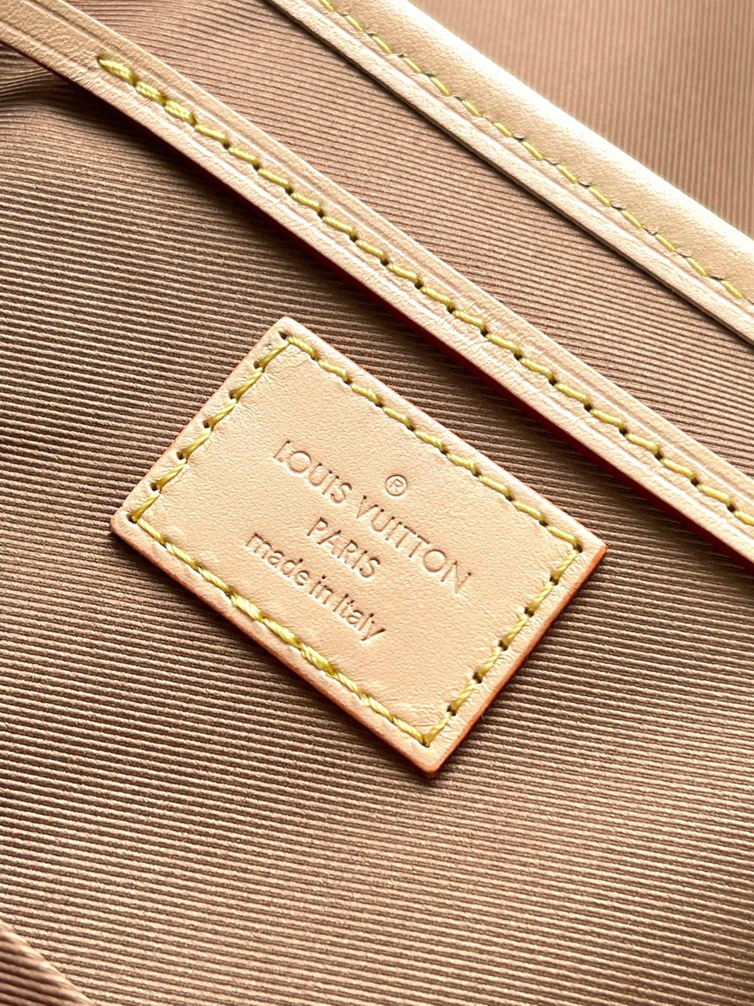 Beige interior label reading Louis Vuitton Paris and made in