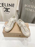 Luxury shoes by Golden Goose: light beige lace-up sneakers, side view pair on box