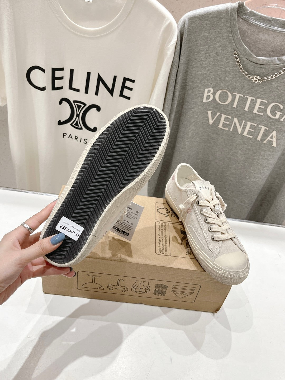 Luxury shoes by Golden Goose: light beige sneakers with textured outsole, one sole shown