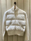 Moncler white puffer jacket with knit ribbed collar, zip front, snap pockets.