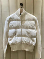 Moncler white puffer jacket with knit ribbed collar, zip front, snap pockets.